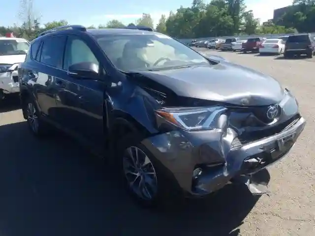 JTMRJREV6JD238572 2018 TOYOTA RAV4 HV LE-0